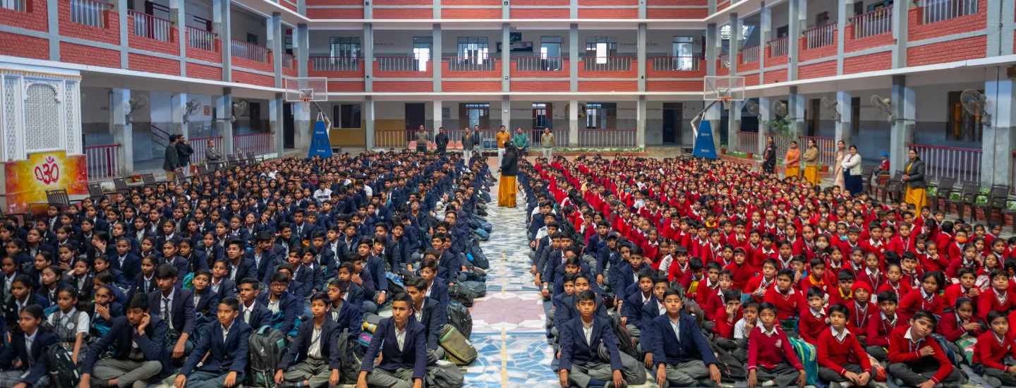 Best school in Udaipur Rajasthan assembly hall with students participating in morning assembly and discipline activities